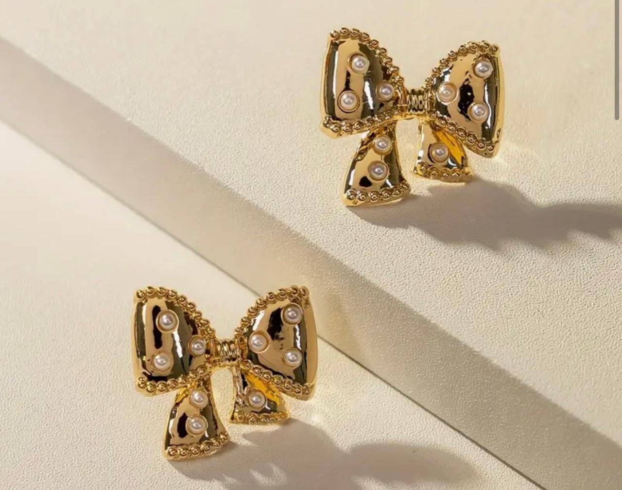 Second image of Elegant Bow Tie Stud Earrings with Faux Pearls